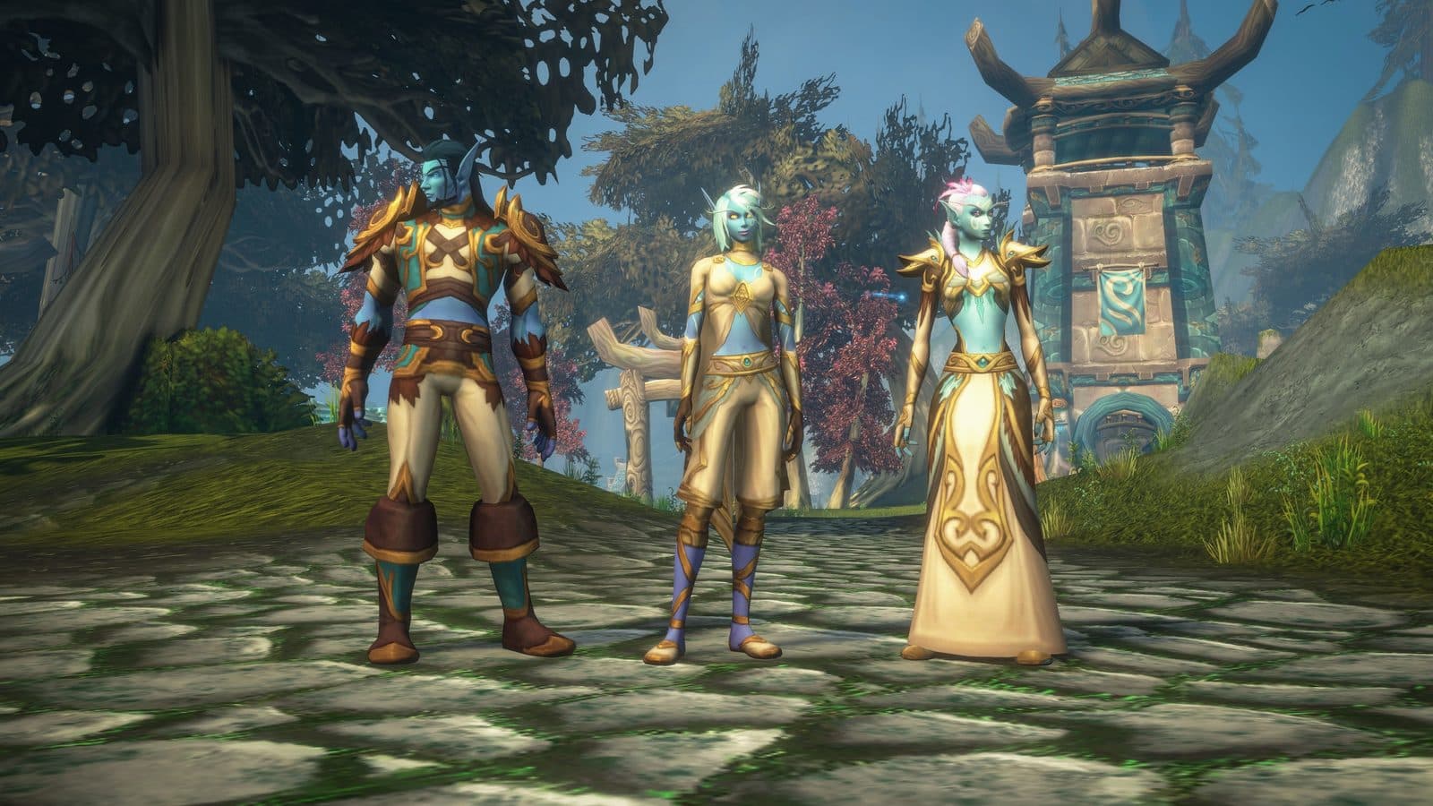 Trois personnages éolides, à la peau bleutée, en tenues dorées, devant une tour et des arbres